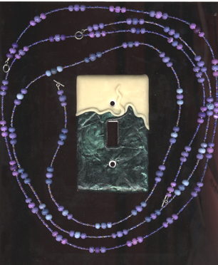 SWITCH PLATE WITH NECKLACES